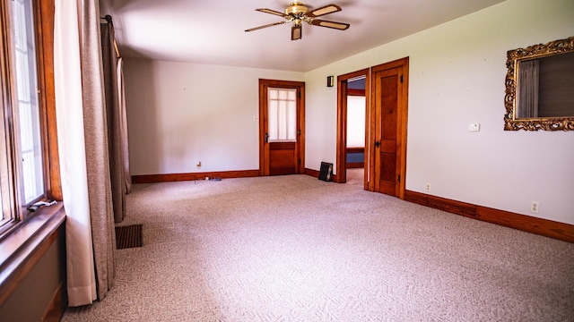 214 W Watson St, Forrest, IL 61741 - unfurnished room featuring ceiling fan, carpet floors, and baseboards