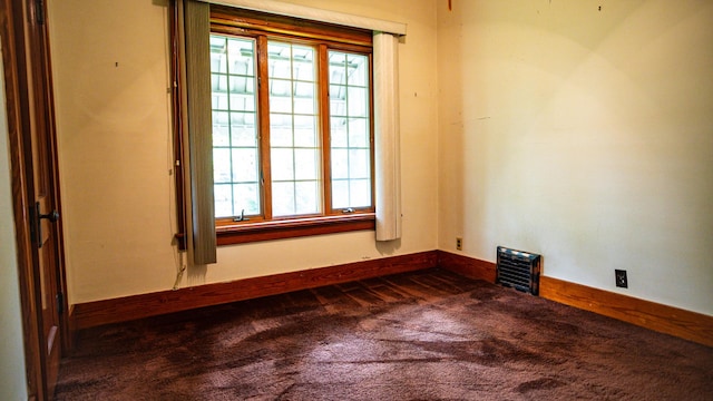 214 W Watson St, Forrest, IL 61741 - spare room featuring carpet floors and baseboards