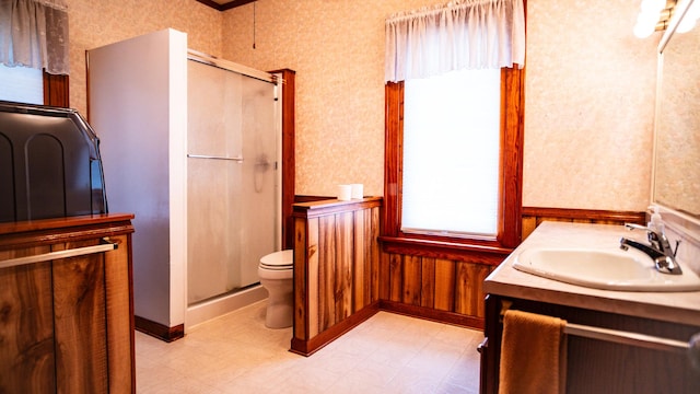 214 W Watson St, Forrest, IL 61741 - bathroom with a shower stall, toilet, vanity, wallpapered walls, and tile patterned floors