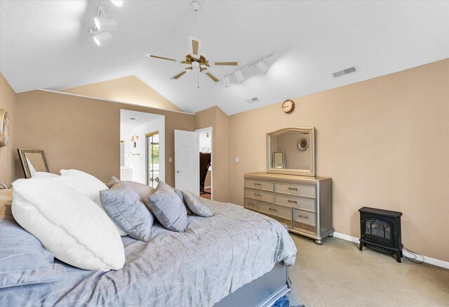 carpeted bedroom featuring baseboards and a textured ceiling