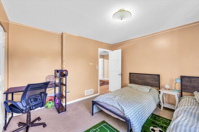 office area with carpet floors, a paneled ceiling, and baseboards