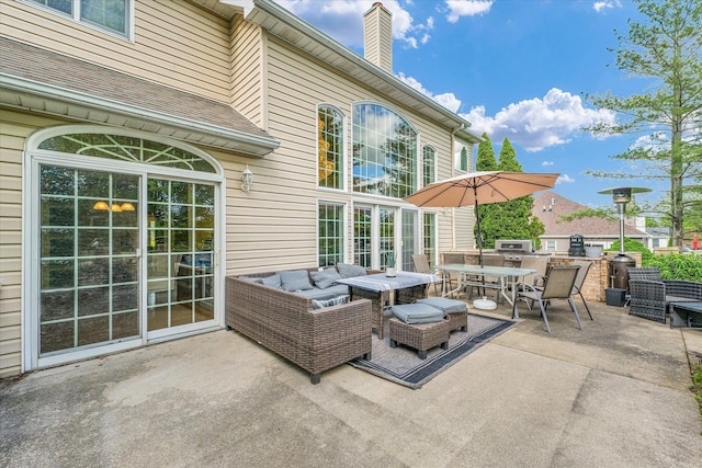 view of patio with outdoor dining area and an outdoor living space