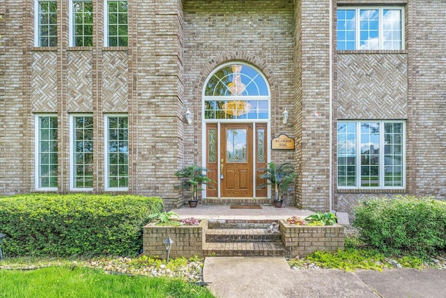 entrance to property with brick siding
