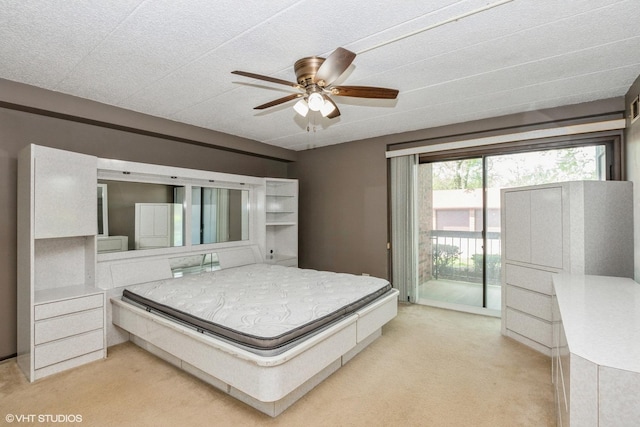 bedroom featuring a ceiling fan, light carpet, and access to exterior