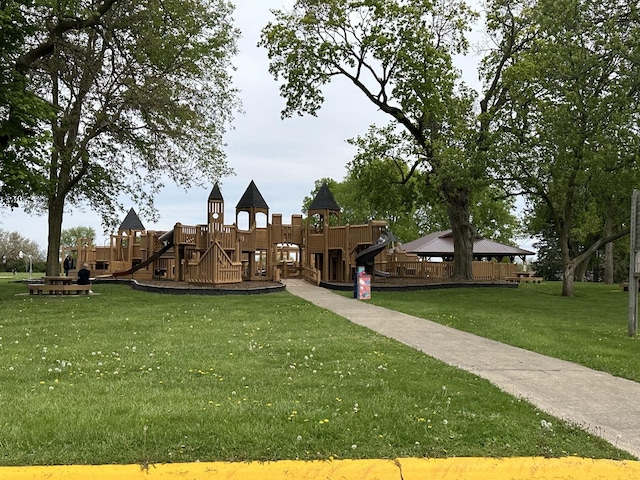 exterior space with a lawn and a playground
