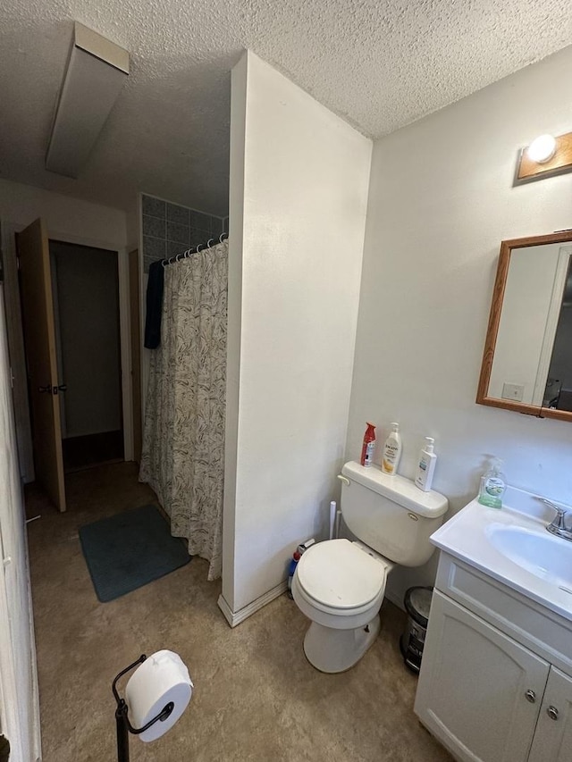 full bathroom with vanity, a textured ceiling, toilet, and a shower with curtain