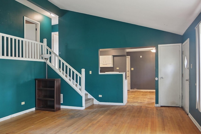 561 Minette Ln, Chicago Heights, IL 60411 - empty room featuring lofted ceiling, stairs, and wood finished floors