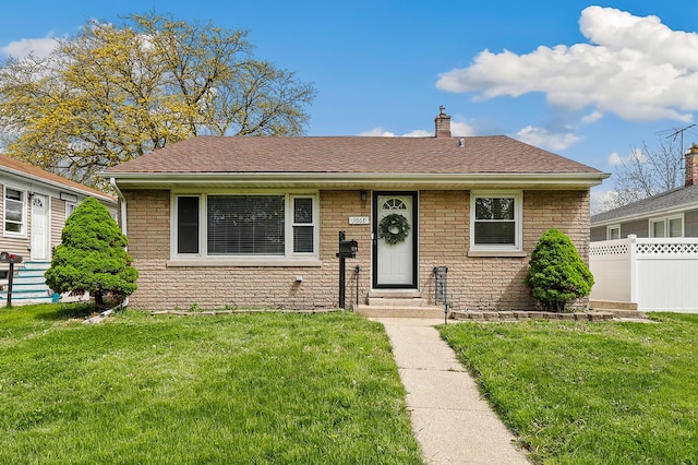 3668 Adams St, Lansing, IL 60438 - view of front of property with entry steps, a chimney, and a shingled roof