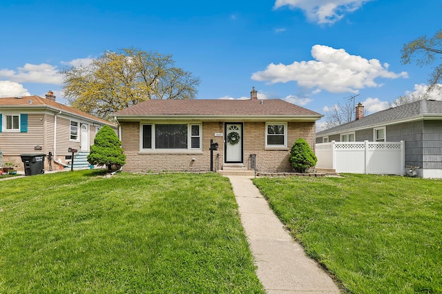 3668 Adams St, Lansing, IL 60438 - view of front of property with brick siding, entry steps, a shingled roof, and a chimney