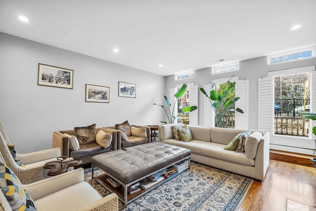 living room with recessed lighting and wood finished floors