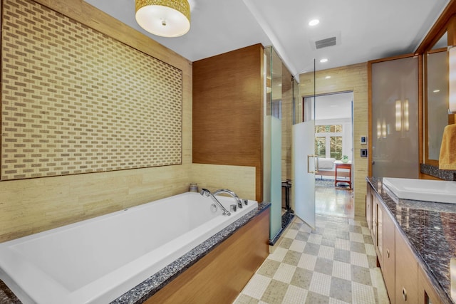 full bathroom with vanity, visible vents, tile patterned floors, a shower stall, and a bath