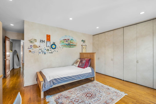 bedroom featuring light wood-style floors and recessed lighting