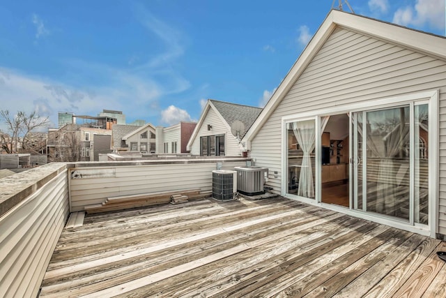 wooden deck featuring cooling unit