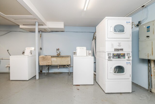 11102 S 84th Ave Unit 2B, Palos Hills, IL 60465 - community laundry featuring stacked washing machine and dryer and washing machine and dryer