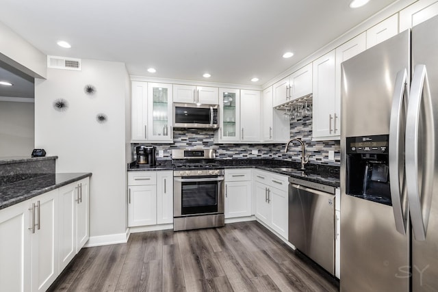 11102 S 84th Ave Unit 2B, Palos Hills, IL 60465 - kitchen featuring stainless steel appliances, a sink, white cabinets, tasteful backsplash, and recessed lighting