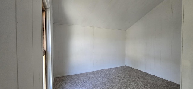 bonus room featuring carpet flooring and lofted ceiling