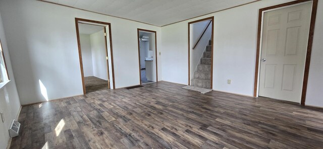 unfurnished bedroom with visible vents and wood finished floors