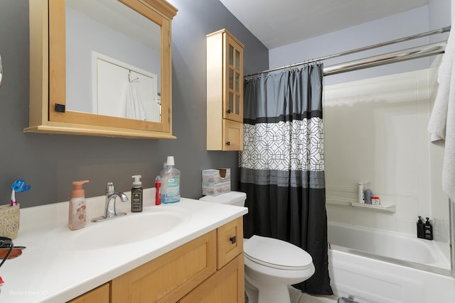 bathroom featuring shower / tub combo with curtain, vanity, and toilet