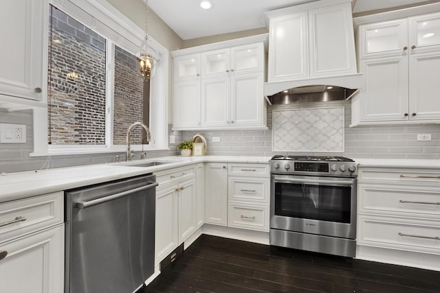 435 W Roslyn Pl Unit 2E, Chicago, IL 60614 - kitchen featuring appliances with stainless steel finishes, premium range hood, white cabinets, dark wood-type flooring, and backsplash