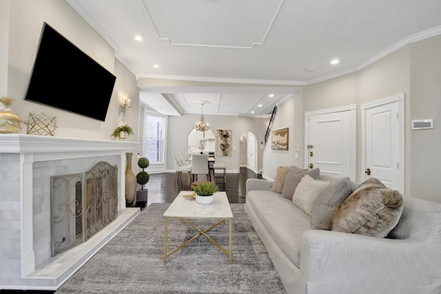 435 W Roslyn Pl Unit 2E, Chicago, IL 60614 - living room with arched walkways, ornamental molding, recessed lighting, wood finished floors, and a fireplace with raised hearth