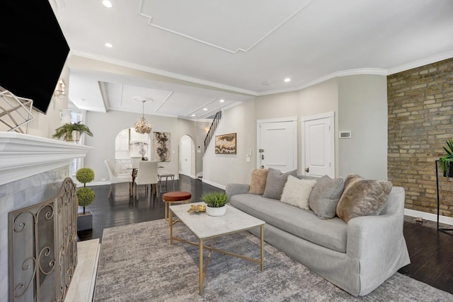435 W Roslyn Pl Unit 2E, Chicago, IL 60614 - living room featuring arched walkways, wood finished floors, recessed lighting, ornamental molding, and a fireplace