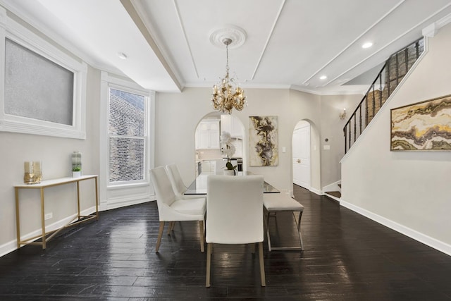 435 W Roslyn Pl Unit 2E, Chicago, IL 60614 - dining area featuring arched walkways, a chandelier, dark wood-style floors, ornamental molding, and stairs