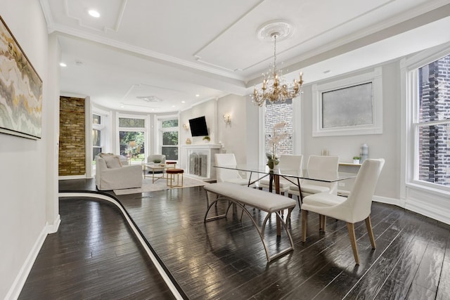 435 W Roslyn Pl Unit 2E, Chicago, IL 60614 - dining room featuring hardwood / wood-style floors, a fireplace, healthy amount of natural light, ornamental molding, and a chandelier