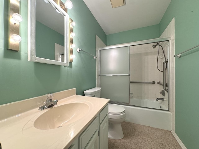 full bath with toilet, vanity, and shower / bath combination with glass door