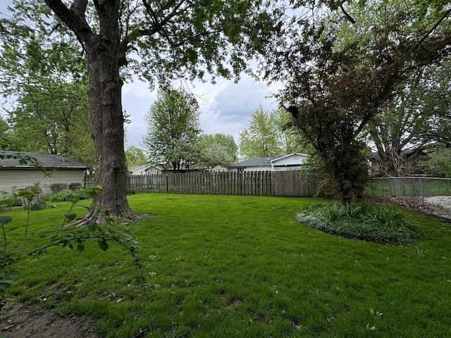 view of yard with a fenced backyard