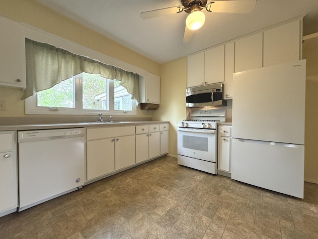 kitchen featuring a ceiling fan, white appliances, a sink, light countertops, and white cabinets
