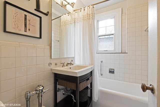 bathroom featuring shower / tub combo and a sink