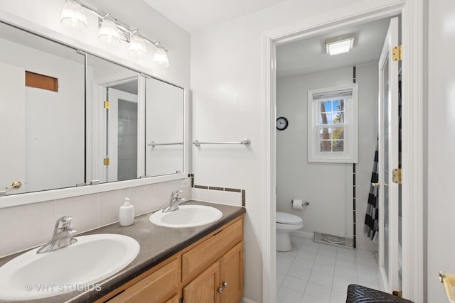29W107 Lakeside Dr, Naperville, IL 60564 - bathroom featuring toilet, tile patterned floors, double vanity, and a sink