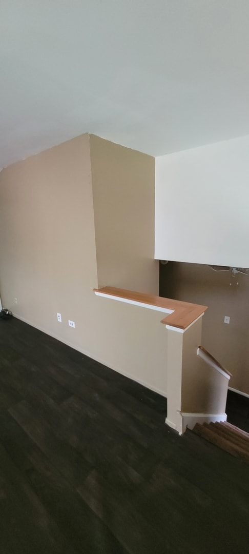 additional living space with wood finished floors