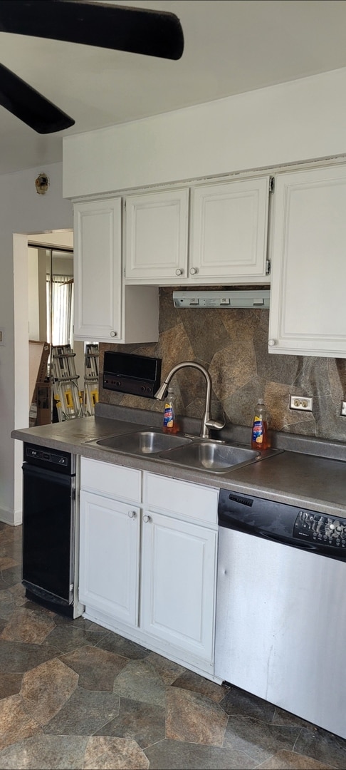 kitchen with white cabinets, stainless steel dishwasher, and a sink