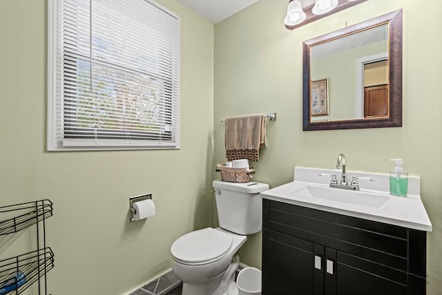 bathroom featuring toilet and vanity