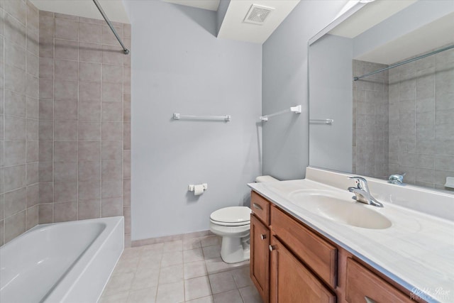 full bath with toilet, vanity, visible vents, tile patterned floors, and baseboards