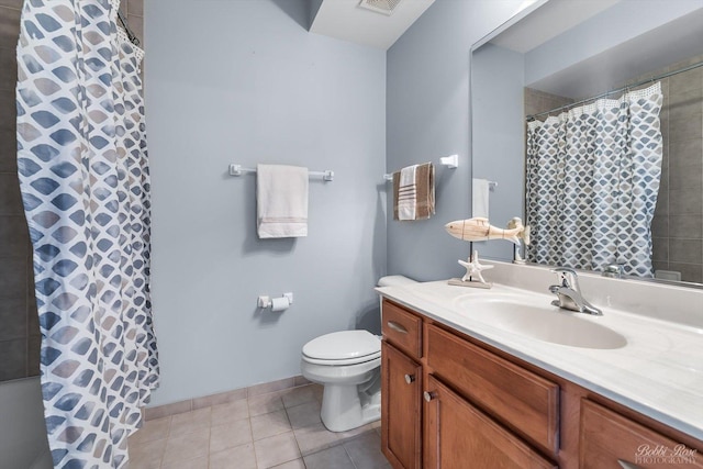 235 N Smith St Unit 509, Palatine, IL 60067 - bathroom with toilet, vanity, tile patterned floors, baseboards, and a shower with shower curtain