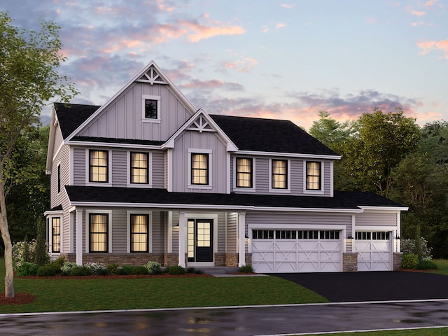 view of front of house featuring driveway, board and batten siding, an attached garage, stone siding, and a front lawn
