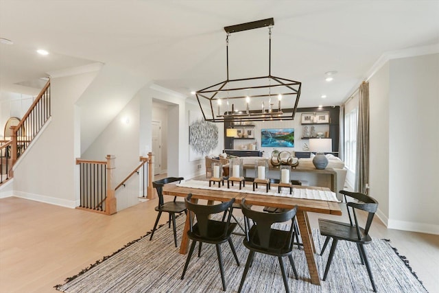 dining area featuring recessed lighting, baseboards, ornamental molding, and light wood-type flooring