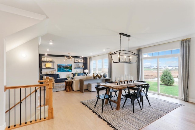 dining area featuring recessed lighting, a chandelier, and light wood-style flooring