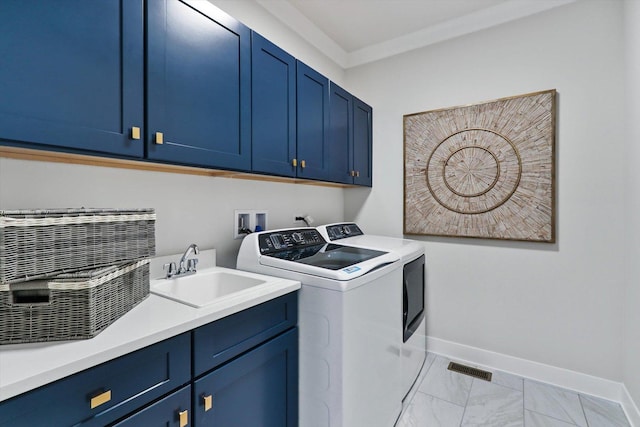 clothes washing area featuring baseboards, marble finish floor, a sink, separate washer and dryer, and cabinet space