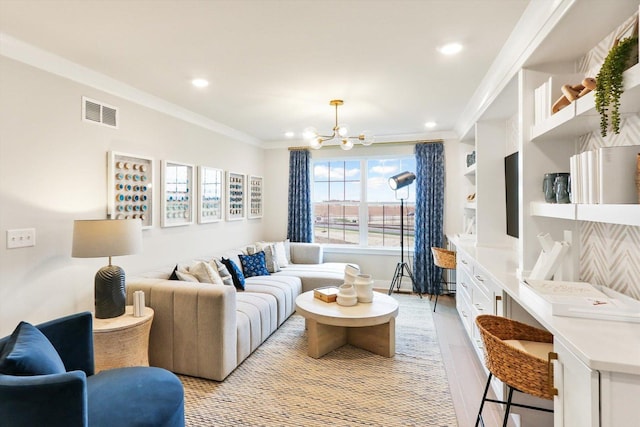 living area featuring light wood finished floors, a notable chandelier, crown molding, visible vents, and recessed lighting