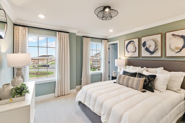 carpeted bedroom featuring ornamental molding, baseboards, and recessed lighting