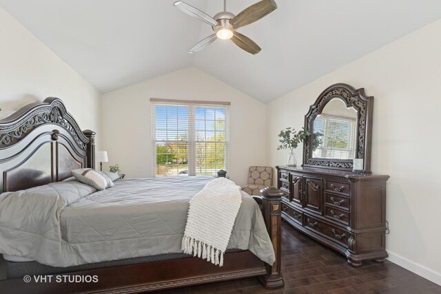 bedroom with dark wood-style floors, baseboards, lofted ceiling, and ceiling fan