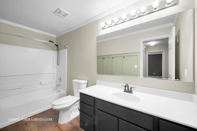 bathroom featuring toilet, wood finished floors, visible vents, vanity, and ornamental molding