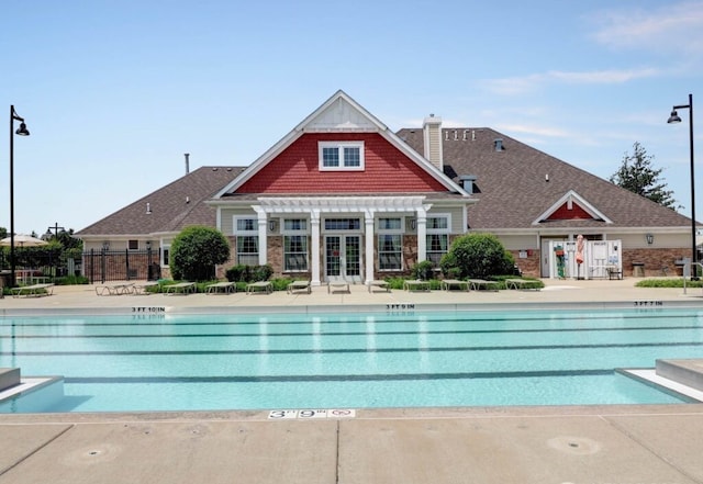 pool featuring a pergola, a patio, and french doors