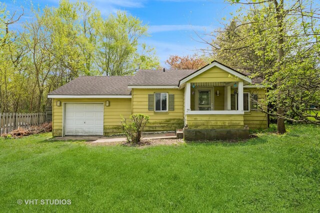 561 S Drive Drive S, Elgin, IL 60177 - bungalow with a shingled roof, a garage, and driveway