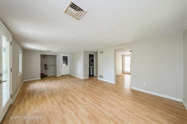561 S Drive Drive S, Elgin, IL 60177 - unfurnished living room with light wood-style floors and baseboards