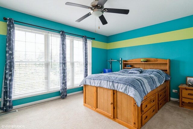 12116 Winterberry Ln, Plainfield, IL 60585 - bedroom featuring light colored carpet, baseboards, and a ceiling fan