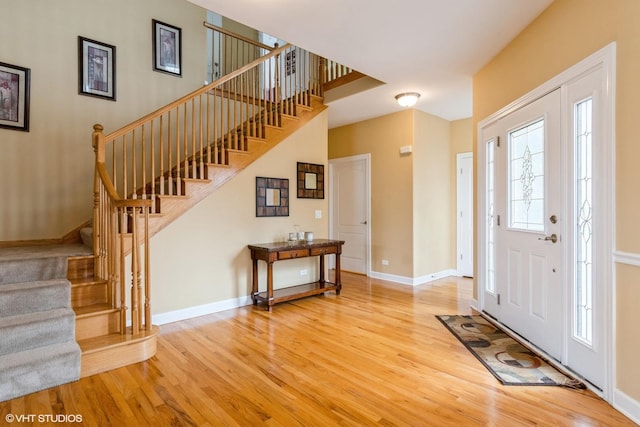 12116 Winterberry Ln, Plainfield, IL 60585 - entrance foyer featuring wood finished floors, stairs, and baseboards